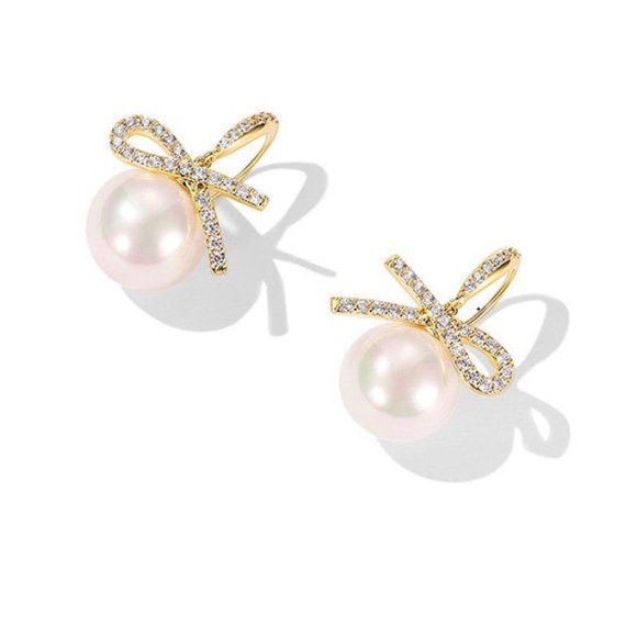 Shashi 18K Gold Plated Pearl Drop
Earrings with Pave Ribbon Bow, NWT - Picture 3 of 3